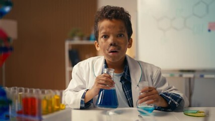 Funny boy reveals dirty face after failed lab experiment, chemical explosion