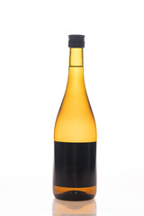 Bottle made from amber glass on white background with reflection on it, empty label mock-up, copy space
