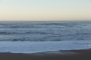 Beach and sea background, view of the Atlantic ocean, from a city in Europe.