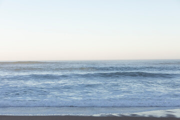 Fototapeta premium Beach and sea background, view of the Atlantic ocean, from a city in Europe.