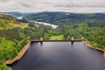 Fototapeta premium Aerial view wtih beautiful green landscape Derwent Dam, snake road bridge Peak District