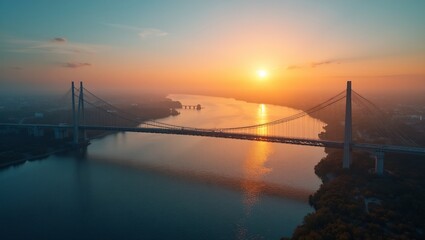 Fototapeta premium Sunset bridge over river conveying unity