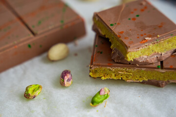Trend Dubai chocolate with pistachio paste and kataifi dough. Confectionery handmade sweets at home in the kitchen. 