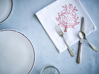 plate and cutlery place setting on table