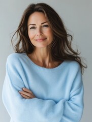 Obraz premium A woman in a light blue cashmere sweater.