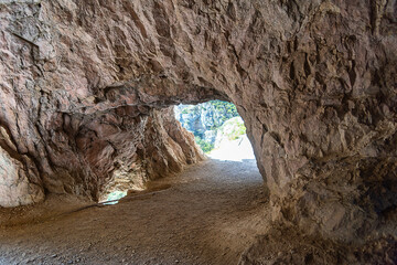 a through road passing through the mountain, a passage in the rock
