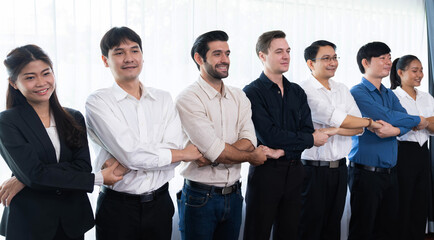 Business team standing, join and link hand together in panoramic banner symbolize successful...