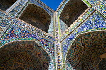 Courtyard of ancient building decorated by majolica tiles in Samarkand, Uzbekistan