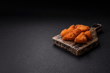 Brie cheese or camembert fries in breading, fast food, takeaway