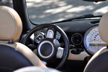 Dashboard of a convertible car, interior of a car with driving gauges