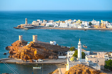 Panoramic view of ancient city Sur with Gulf of Oman, lighthouse and traditional architecture in Oman