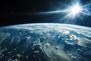 Fototapeta premium Earth view from space, sun shining through clouds