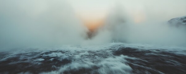 Stormy Nordic sea waves in heavy winter fog with warm light. Dynamic seascape of Scandinavian coast in dramatic weather. Moody nature photography