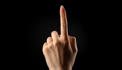 Hand with raised index finger on a black background