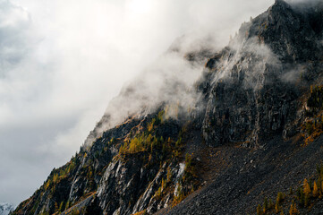 Clouds descend on the rocks at dawn