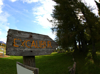 EXCALIBUR trail sign leads through the forest toward the sword in the stone