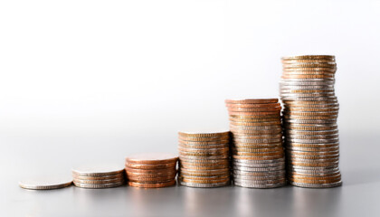 Stack of coins on side position provides copy space for text. background concept isolated white