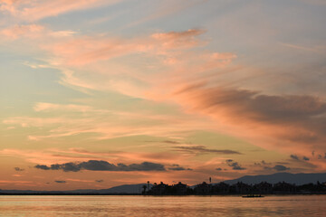 Beautiful, colorful clouds at sunset sky on a sea	
