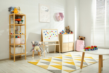 Beautiful child's room interior with toys and stylish furniture