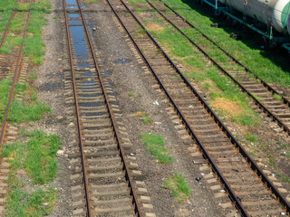 Obraz premium Rails with sleepers. Many tracks. Railway tracks. Railway crossing.