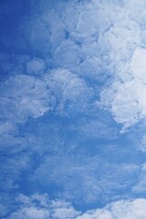 photo of beautiful white clouds in a clear daytime sky