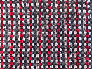 Striped pattern fabric, close-up as texture. Old-fashioned cotton or linen textile in retro style with different colors on the background. Checkered background