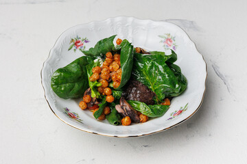 Warm meat salad with chickpeas and herbs