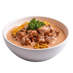 Thai food Khao Soi chicken dish with creamy sauce and noodles, garnished with fresh parsley in a white bowl. isolated on white background.