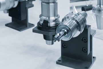 A machine with a tool on it. The tool is on a stand. The stand is black