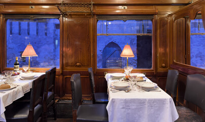 An Elegant Dining Interior Featuring a Scenic Evening View That Creates a Lovely Ambiance