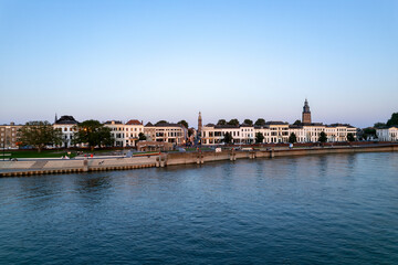 Countenance cityscape of historic Hanseatic Zutphen, The Netherlands, at sunset against a clear blue sky