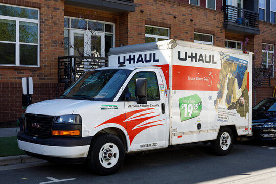 CHARLOTTE, NC-5 MARCH 2023: NoDa District.  U-haul rental truck/van parked in front of apartment building.