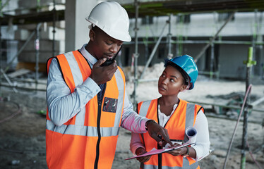 People, paperwork and team conversation at construction site, walkie talkie and checklist for plan. Employees, engineering and assessment of infrastructure, safety gear and outdoor for inspection