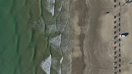 The waves large and small continue to lap on shore of the beaches along the Gulf of Mexico in Port...