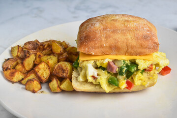scramble egg sandwich with  home fries