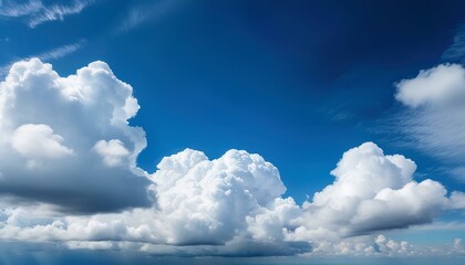 big fluffy white clouds and blue sky