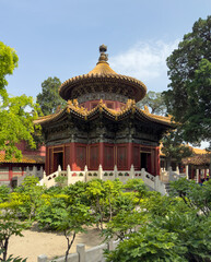 A Beautiful Traditional Chinese Pavilion That Is Surrounded by Lush Greenery All Around