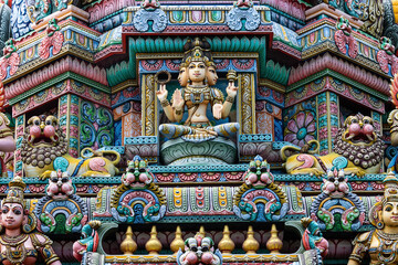 Colored decorations and statues on the exterior of the Hindu Temple Sri Maha Mariamman Temple ("Wat Phra Si Maha Umathewi") on Si Lom Road in Bangkok, Thailand. Built in1879.
