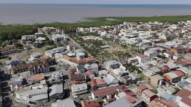 Drone descends on Place des Palmistes in the late afternoon in Cayenne, French Guiana, France