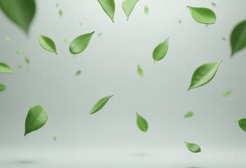Green leaves falling on gray background