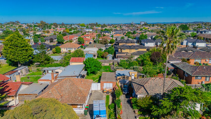 Panoramic aerial drone view of Northern Melbourne Suburbs with Houses roads and parks in Melbourne Victoria Australia
