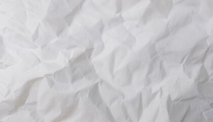 Obraz premium Crumpled white paper texture with abstract folds and creases.
