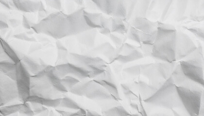 Obraz premium Crumpled white paper showcasing a textured background.