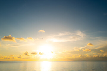 Cloudy sky on sea sunset, sunrise on ocean beach. Sunset landscape in the sky after sunset. Sunrise with clouds of different colors against the sky and sea.