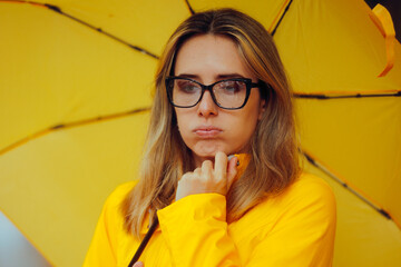 Sad Woman with Rain on Her Glasses During Rainstorm. Unhappy lady feeling sorrowful during fall season
