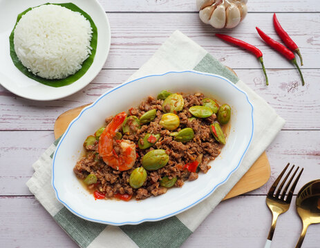 Stir fried bitter bean with minced pork and shrimp - Thai food called Sator at top view 