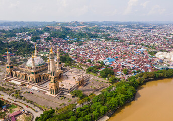 Aerial view of Baitul Muttaqien Mosque, the biggest mosque and islamic center in Samarinda, East Kalimantan, Indonesia. Located on the banks of the Mahakam River.