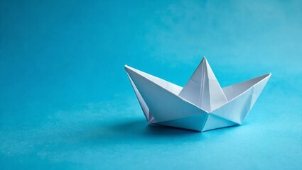 Obraz premium White Paper Boat on a Solid Background