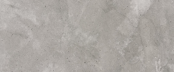Detailed view of a textured gray concrete wall with subtle variations in color and surface. Premium classic wall background photo for banner background or wallpaper.