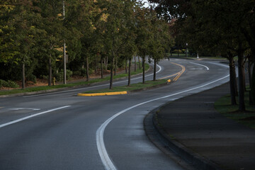 Empty curved residential street in Redmond in twilight colors in late October